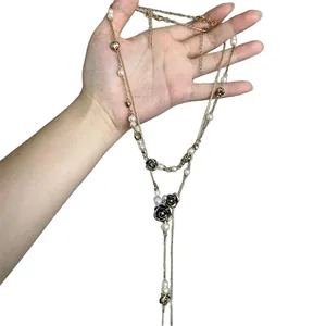 Elegant vintage double layer pearl necklace with black rose pendants and long tassels