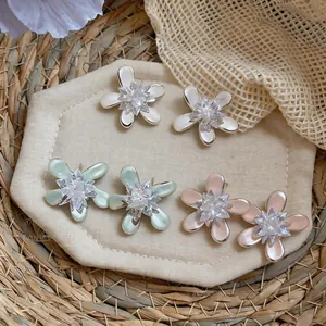 Elegant flower stud earrings with sparkling crystal center available in three sweet colors