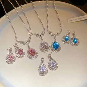 Elegant water-drop rhinestone necklace and earring sets in pink, blue, and white