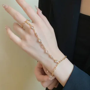 Vintage gold-tone hand chain with heart resin stones and ring-bracelet link