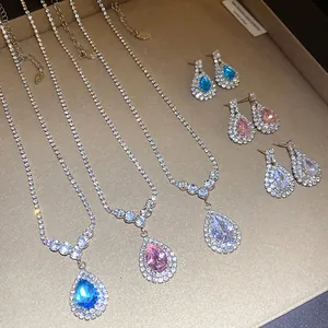Detailed close-up view of elegant teardrop crystal necklaces and matching earrings set
