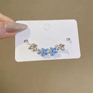 Exquisite blue flower and rhinestone butterfly stud earring set on display card