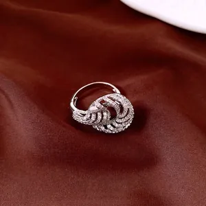 Elegant silver-toned twisted ring encrusted with sparkling cubic zirconia stones