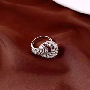 Detailed view of an elegant silver-toned ring with twisted pave-set zircon design