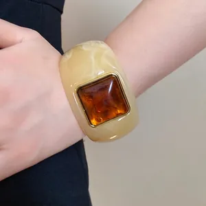 Chunky cream marble acrylic cuff bracelet with square amber resin center inlay and gold frame