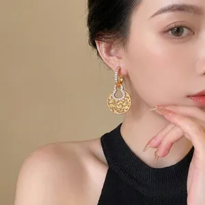 Elegant 18k gold plated hollow gourd earrings with sparkling zircon accents.