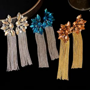 Elegant floral crystal drop earrings with long metal tassels in silver and gold tones