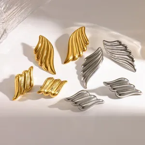 Elegant angel wing stud earrings in 18k gold and silver textured stainless steel