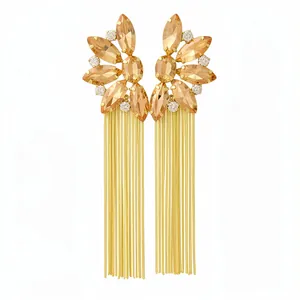 Elegant floral rhinestone fringe drop earrings with long gold tassels on a white background