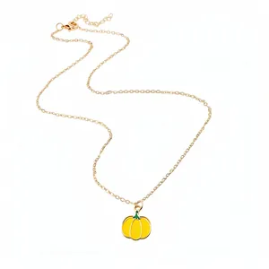 Gold-plated clavicle chain necklace featuring a vibrant yellow enamel pumpkin pendant
