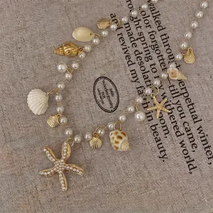 Elegant Baroque vintage pearl necklace featuring gold starfish and sea shell charms