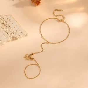 Chaîne de main élégante en acier titane doré avec perles et breloque aile
