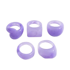 Set of 5 purple marbled resin rings featuring geometric square and round shapes
