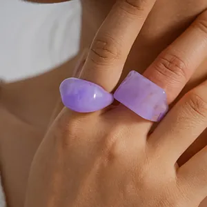 Macro detail of purple marbled resin rings showing unique swirled texture and finish