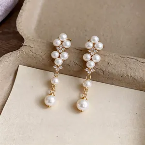 Elegant French style gold-tone pearl and zircon drop earrings for a luxury look