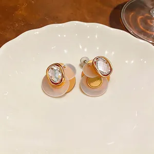 Elegant 18k gold plated geometric stud earrings with clear faceted cubic zirconia.