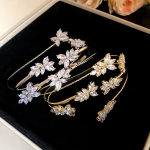 Close-up detail of marquise-cut zircon wheat ear pattern on elegant fashion bangles.
