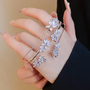 Close-up view of silver-toned zircon wheat ear bracelet and adjustable matching ring