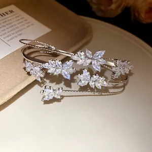 Close-up detail of an elegant silver zircon wheat ear bracelet with sparkling crystals