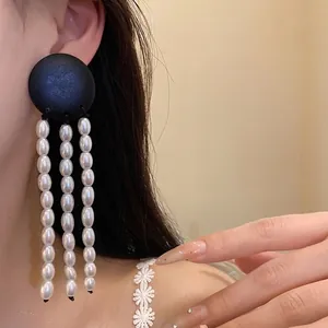 Elegant vintage black wood and pearl tassel earrings with geometric design for women.