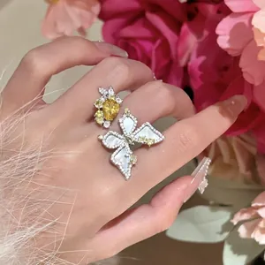 Exquisite silver butterfly ring detail with yellow zircon and mother of pearl wings