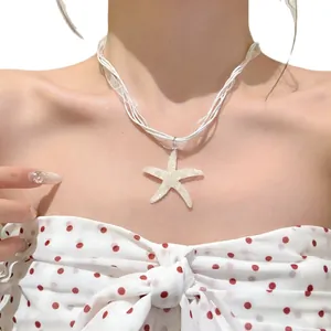Beach vacation style resin starfish pendant necklace with elegant white snow yarn ribbon