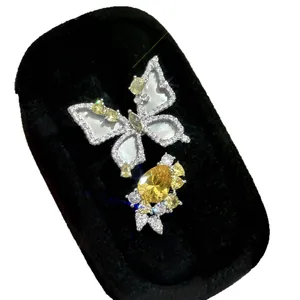 Elegant butterfly and flower zircon ring with yellow crystal in black velvet box