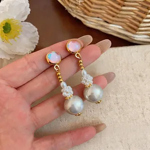 French style pearl drop earrings with iridescent bead and gold-tone finish