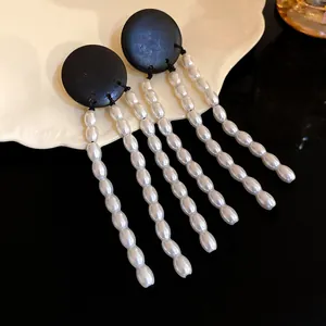 Vintage style black wood stud earrings featuring elegant long pearl tassels for women