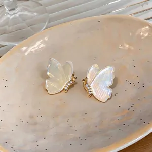 Elegant 18k gold plated butterfly stud earrings with iridescent wings and crystals