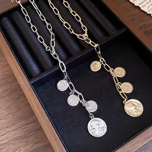 Elegant gold and silver metallic chain necklaces featuring multiple portrait coin pendants