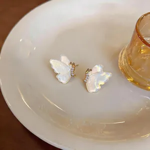 Elegant 18k gold plated butterfly stud earrings with pearl-like resin and zircon details