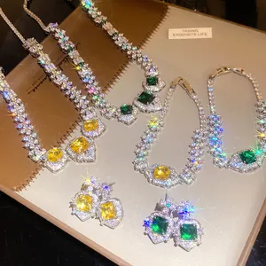 Close-up detail of luxury court style zircon square pendant necklace bracelet and earring set