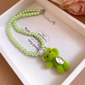 Charming green plush bear pendant necklace featuring elegant light green imitation pearls