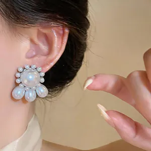 Elegant silver needle pearl stud earrings with round and teardrop pearls for women