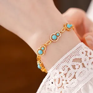 Elegant gold gourd bracelet featuring turquoise stones and sparkling zircon accents