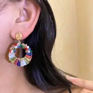 Handmade multicolored crystal beaded hoop earrings with vibrant faceted glass segments
