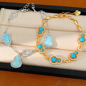 Detail of elegant gold and silver hulu gourd bracelets with blue stones and sparkling zircon