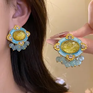 Vintage palace style oval resin stud earrings with blue enamel beads and gold finish decor
