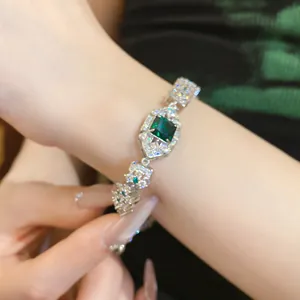 Macro view of an elegant emerald green square zircon bracelet with refined palace style