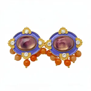 Vintage palace style oval resin stud earrings with gold accents and orange beads