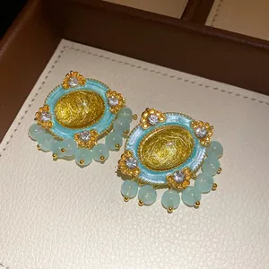 Vintage court style oval earrings with turquoise resin and light green bead charms