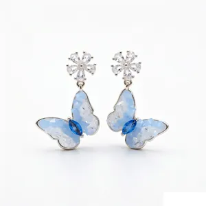 Elegant light blue butterfly flower stud earrings with zircon stones and silver needles.