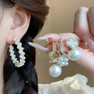 Elegant French style silver needle pearl earrings with sparkling zircon flower accents