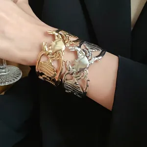 Vintage hollow-out metal cuff bracelet featuring crab fish and seashell design