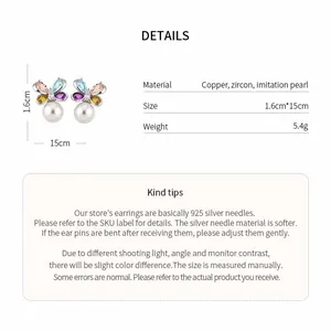 Detailed view of elegant zircon butterfly earrings featuring imitation pearl drops and silver needles