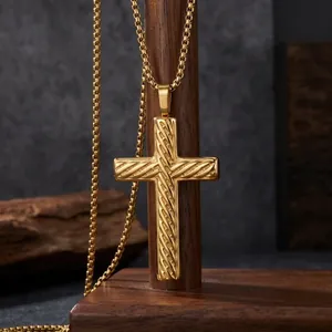 Masculine gold stainless steel twill cross pendant necklace displayed on wood stand