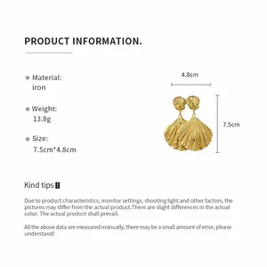 Detail of gold shell drop earrings with material weight and size specifications