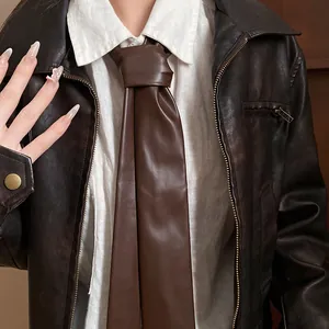 Close-up detail of a vintage brown leather tie necklace for women's daily fashion