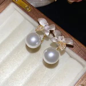 Elegant white flower pearl earrings with sparkling crystals in a luxury wooden gift box